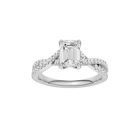 A top view of 14K white gold Amorati Vignette emerald diamond solitaire with prong setting and diamond band