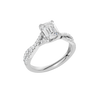 An angled view of 14K white gold Amorati Vignette emerald diamond solitaire with prong setting and diamond band