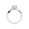 A side profile view of 14K white gold Amorati Vignette pear diamond solitaire with prong setting and diamond band