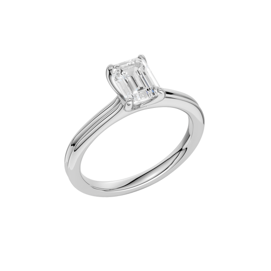 An angled view of the Emerald cut diamond engagement ring in platinum with a plain band and solitaire setting