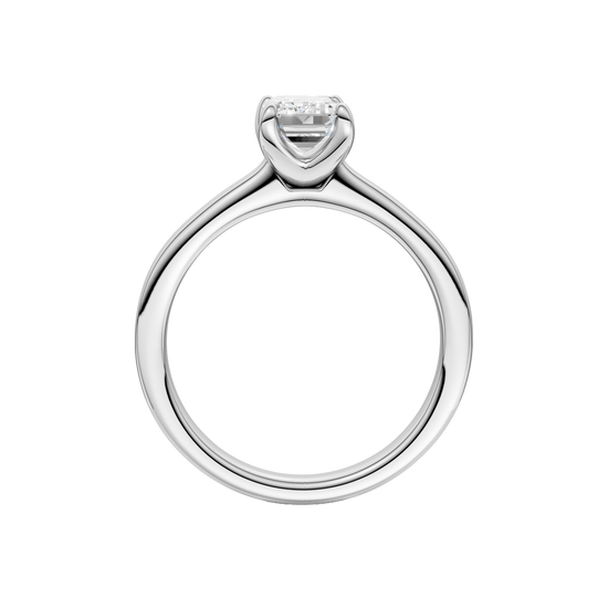 A profile view of the Emerald cut diamond engagement ring in 14k white gold with a plain band and solitaire setting