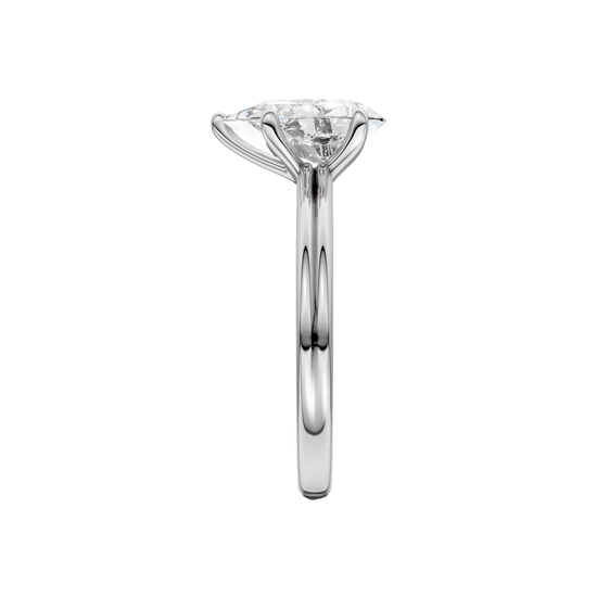 A side view of the Pear cut diamond engagement ring in 14k white gold with a plain band and solitaire setting