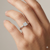 Princess cut diamond engagement ring in 14k white gold with a plain band and solitaire setting on a hand
