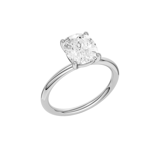 Angled view of the Elongated cushion cut diamond engagement ring in platinum with a plain band and solitaire setting