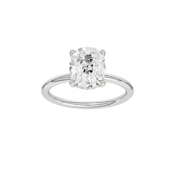 A front view of the elongated cushion-cut diamond on a clean, sculptural white gold band.