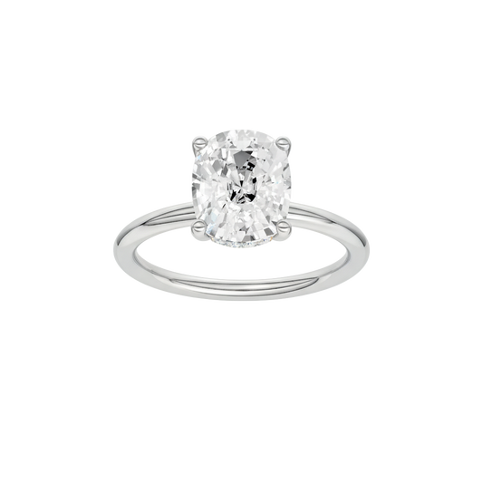A front view of the elongated cushion-cut diamond on a clean, sculptural white gold band.