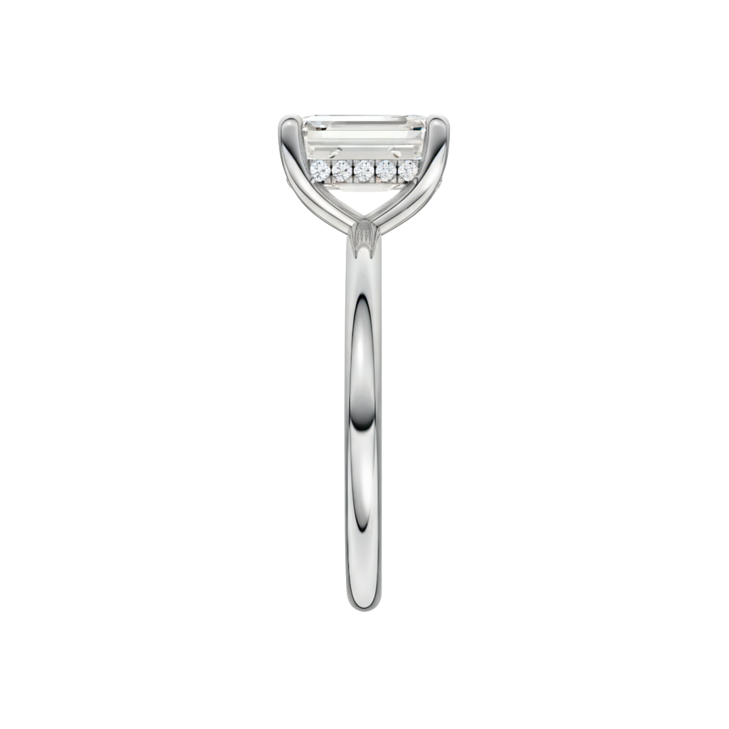 A side view of the Emerald cut diamond engagement ring in platinum with a plain band and solitaire setting