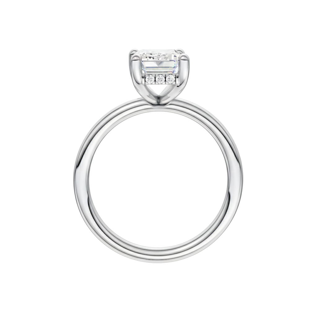 A profile view of the Emerald cut diamond engagement ring in platinum with a plain band and solitaire setting