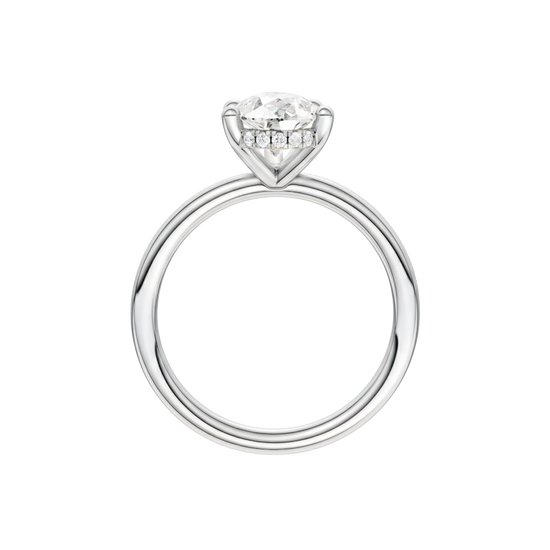 A profile view of the Pear cut diamond engagement ring in 14k white gold with a plain band and solitaire setting