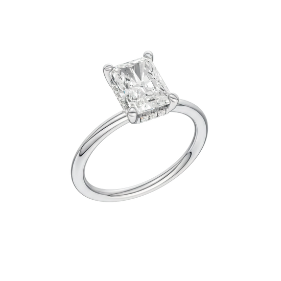 A three-quarter view of the Radiant cut diamond engagement ring in 14k white gold with a plain band and solitaire setting