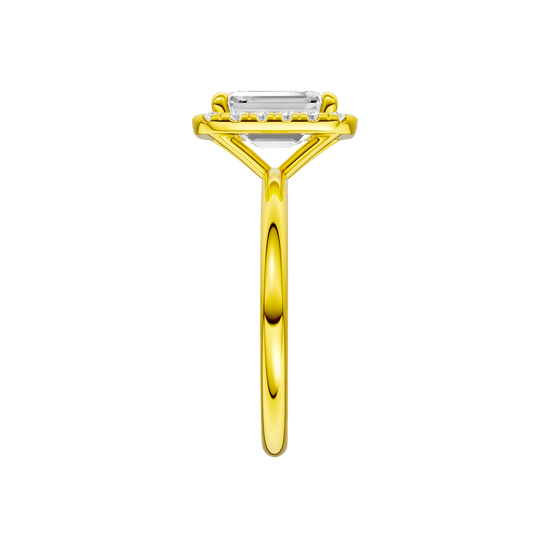 A side view of the Emerald cut diamond engagement ring in 14k yellow gold with a plain band and solitaire setting
