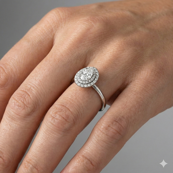 Pear cut diamond engagement ring in 14k white gold with a plain band and solitaire setting on a hand