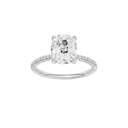 A front view of the Elongated Cushion cut diamond engagement ring in 14k white gold with a pavé diamond band and cathedral setting