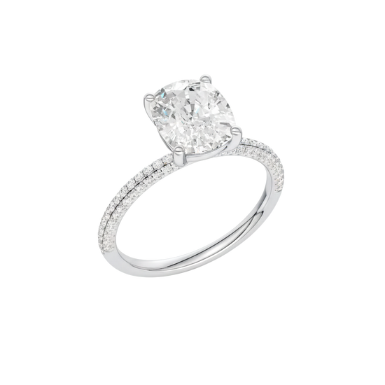 A three-quarter view of the Elongated Cushion cut diamond engagement ring in 14k white gold with a pavé diamond band and cathedral setting