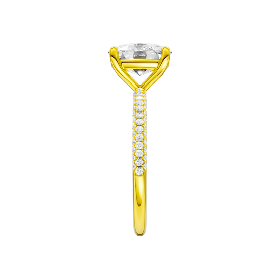 A side view of the Elongated Cushion cut diamond engagement ring in 14k yellow gold with a pavé diamond band and cathedral setting