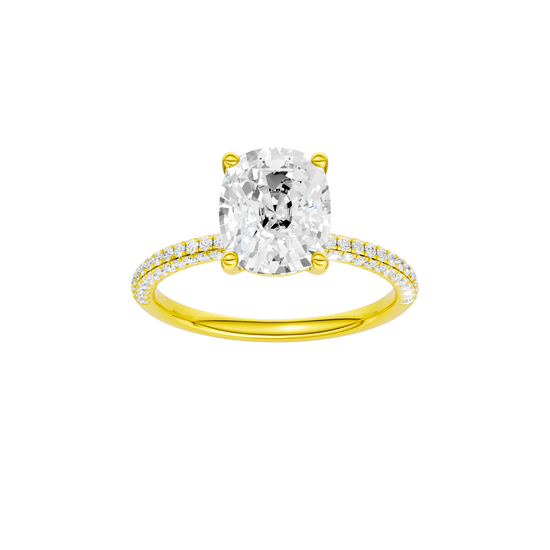 A front view of the Elongated Cushion cut diamond engagement ring in 14k yellow gold with a pavé diamond band and cathedral setting