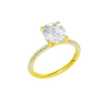 A three-quarter view of the Elongated Cushion cut diamond engagement ring in 14k yellow gold with a pavé diamond band and cathedral setting