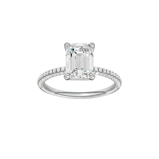 A front view of the Emerald cut diamond engagement ring in 14k white gold with a pavé diamond band and cathedral setting