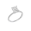 A three-quarter view of the Emerald cut diamond engagement ring in 14k white gold with a pavé diamond band and cathedral setting