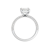 A profile view of the Emerald cut diamond engagement ring in 14k white gold with a pavé diamond band and cathedral setting