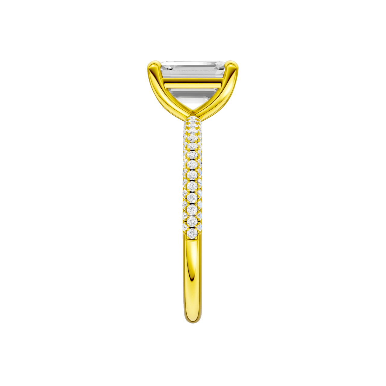 A side view of the Emerald cut diamond engagement ring in 14k yellow gold with a pavé diamond band and cathedral setting