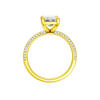 A profile view of the Emerald cut diamond engagement ring in 14k yellow gold with a pavé diamond band and cathedral setting