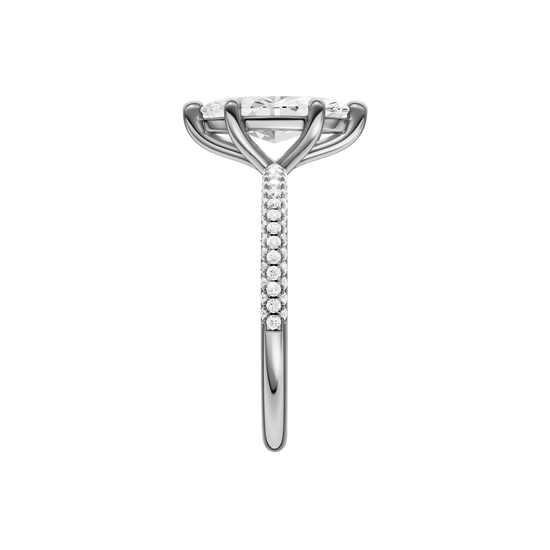 A side view of the Marquise cut diamond engagement ring in platinum with a pavé diamond band and cathedral setting