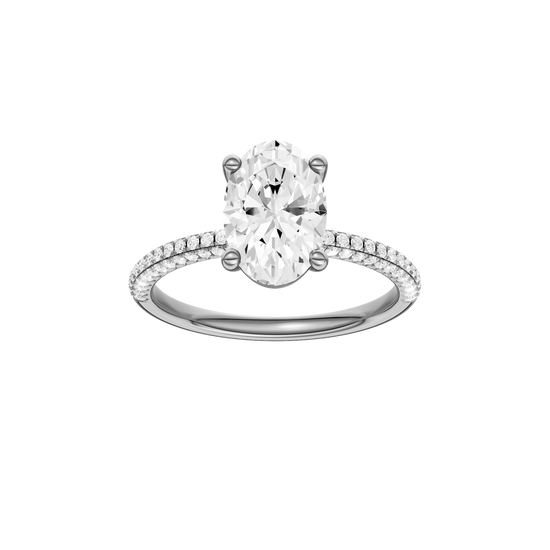 A front view of the oval cut diamond engagement ring in 14k white gold with a pavé diamond band and cathedral setting