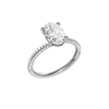 A three-quarter view of the oval cut diamond engagement ring in platinum with a pavé diamond band and cathedral setting