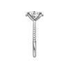 A side view of the oval cut diamond engagement ring in 14k white gold with a pavé diamond band and cathedral setting