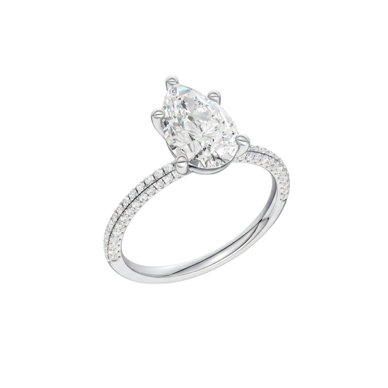 A three-quarter view of the Pear cut diamond engagement ring in platinum with a pavé diamond band and cathedral setting