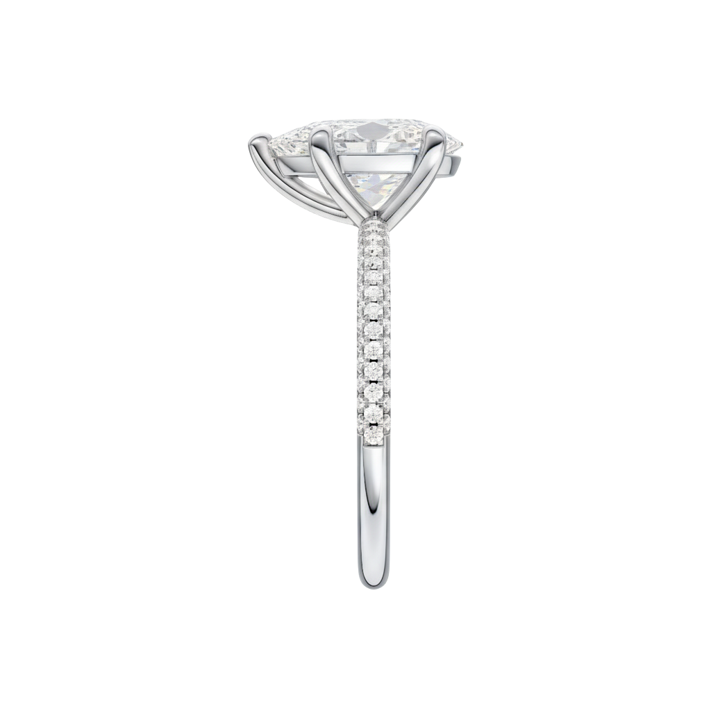 A side view of the Pear cut diamond engagement ring in platinum with a pavé diamond band and cathedral setting