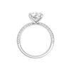A profile view of the Pear cut diamond engagement ring in platinum with a pavé diamond band and cathedral setting