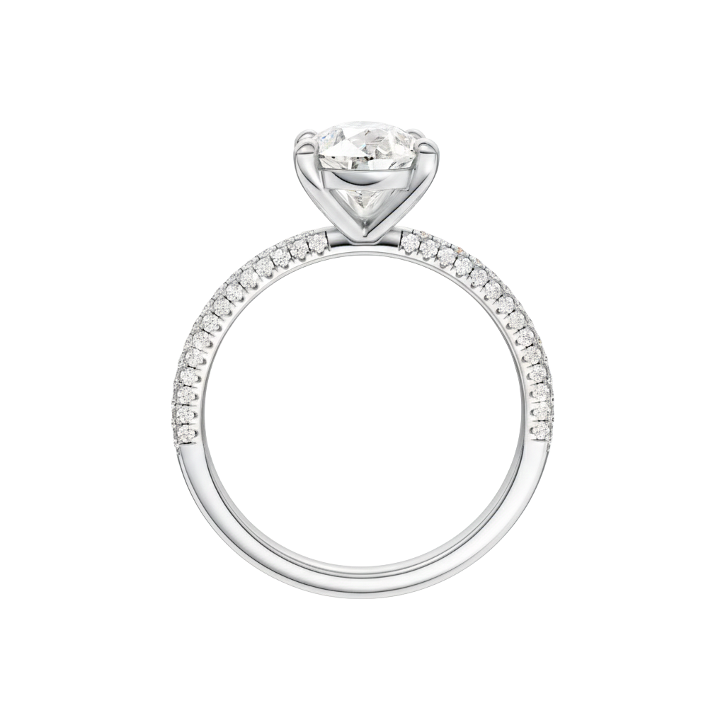A profile view of the Pear cut diamond engagement ring in platinum with a pavé diamond band and cathedral setting