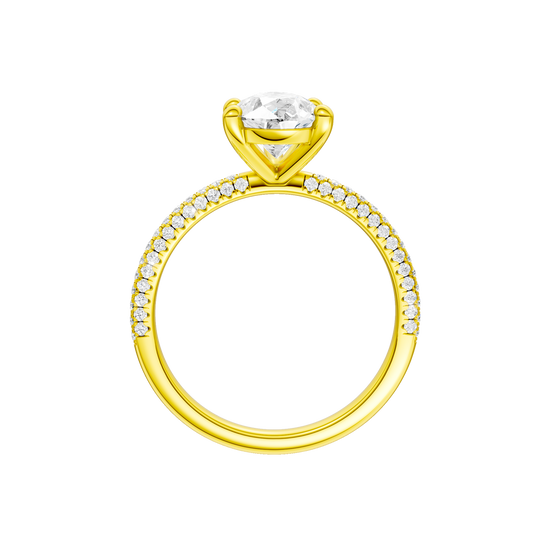 A profile view of the Pear cut diamond engagement ring in 14k yellow gold with a pavé diamond band and cathedral setting