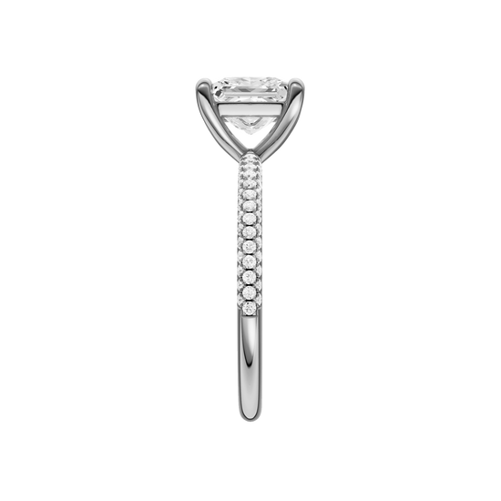 A side view of the Princess cut diamond engagement ring in 14k white gold with a pavé diamond band and cathedral setting