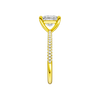 A side view of the Princess cut diamond engagement ring in 14k yellow gold with a pavé diamond band and cathedral setting