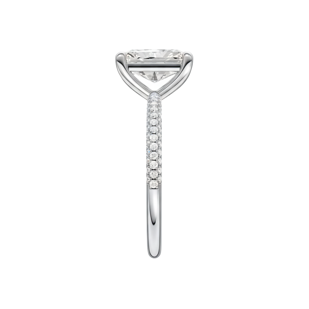 A side view of 14K white gold Amorati Alight radiant diamond solitaire with cathedral setting and pavé band