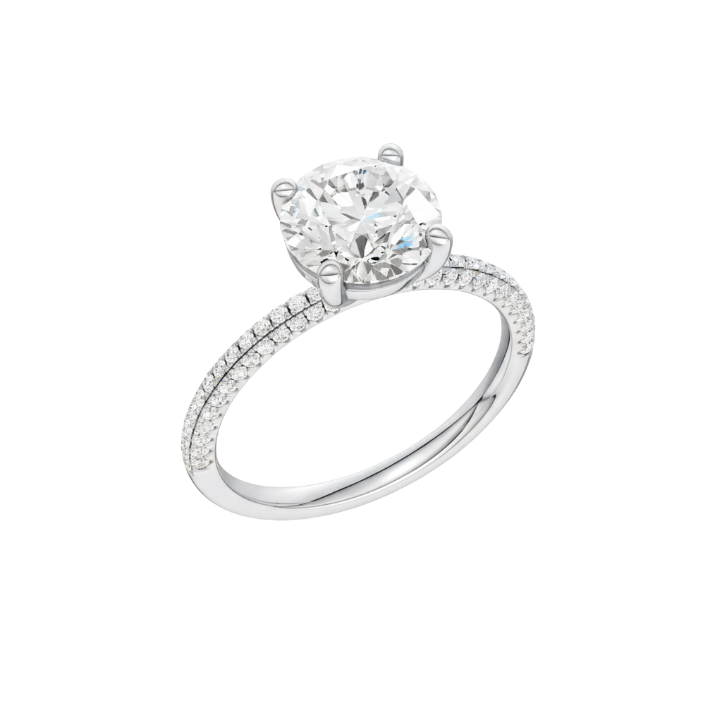 A three-quarter view of the Round cut diamond engagement ring in 14k white gold with a pavé diamond band and cathedral setting