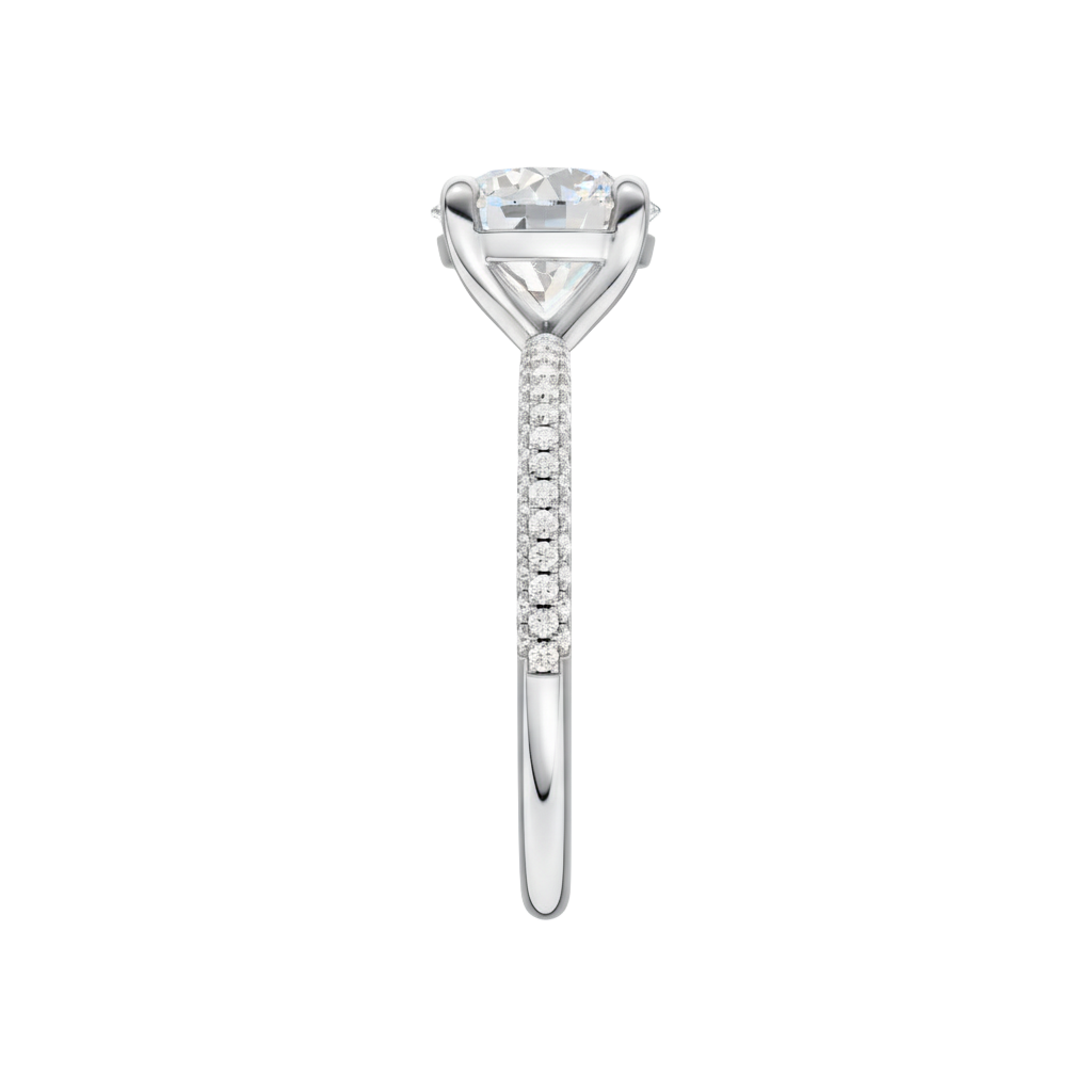 A side view of the Round cut diamond engagement ring in 14k white gold with a pavé diamond band and cathedral setting
