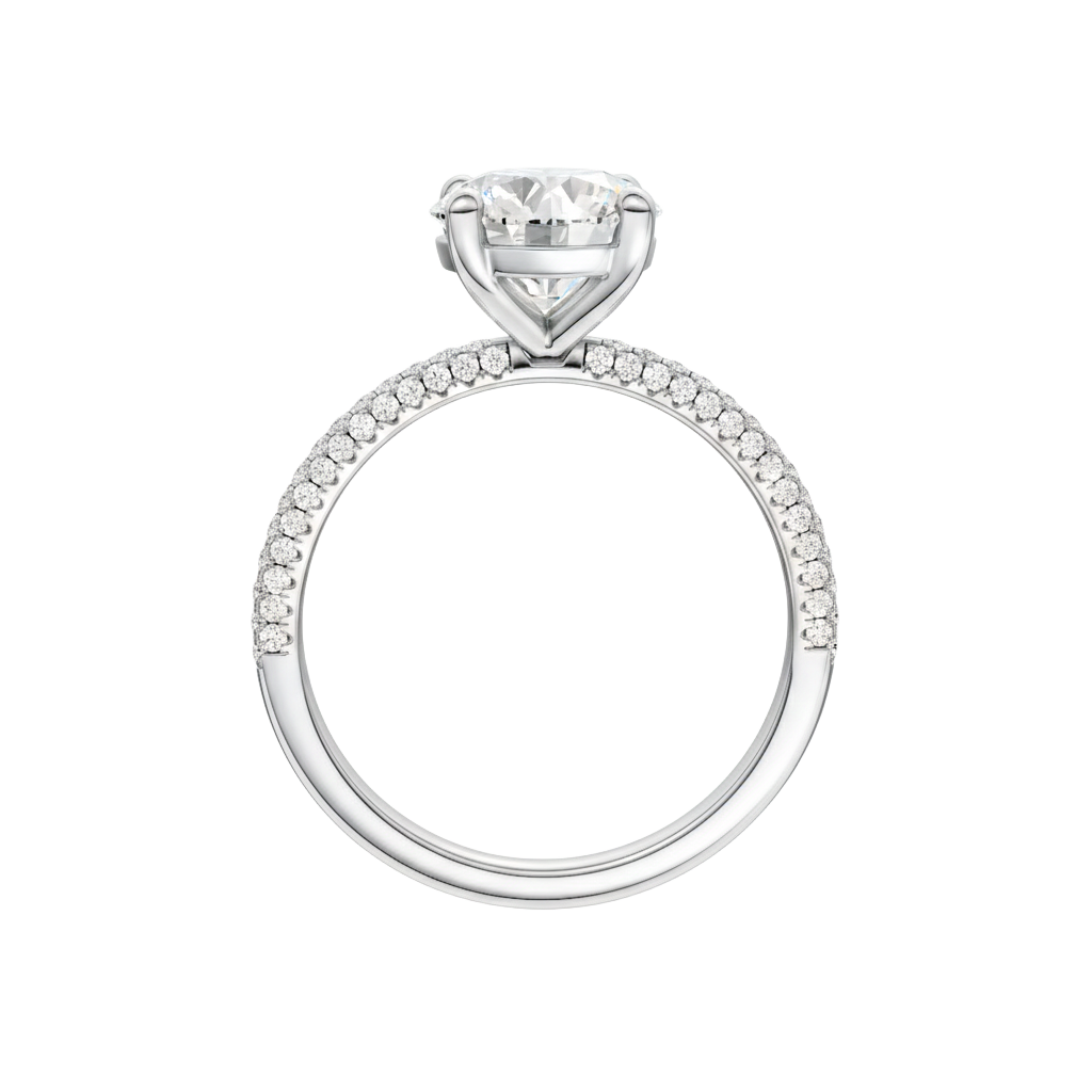A profile view of the Round cut diamond engagement ring in 14k white gold with a pavé diamond band and cathedral setting