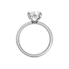 A front view of the Elongated cushion cut diamond engagement ring in platinum with a pavé diamond band and cathedral setting