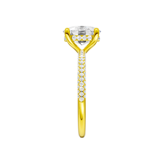 A side view of the Elongated cushion cut diamond engagement ring in 14k yellow gold with a pavé diamond band and cathedral setting
