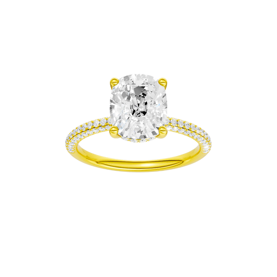 A front view of the Elongated cushion cut diamond engagement ring in 14k yellow gold with a pavé diamond band and cathedral setting