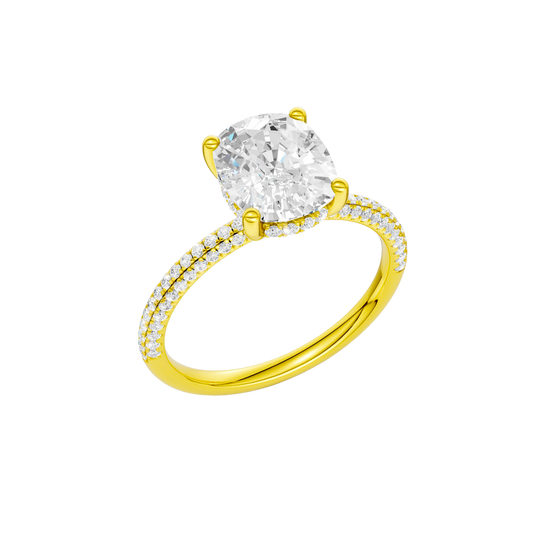 A three-quarter view of the Elongated cushion cut diamond engagement ring in 14k yellow gold with a pavé diamond band and cathedral setting
