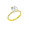 A three-quarter view of the Elongated cushion cut diamond engagement ring in 14k yellow gold with a pavé diamond band and cathedral setting