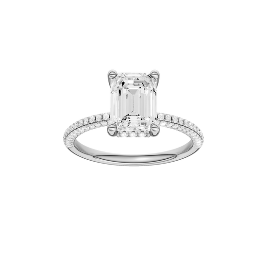 A front view of the Emerald cut diamond engagement ring in 14k white gold with a pavé diamond band and cathedral setting