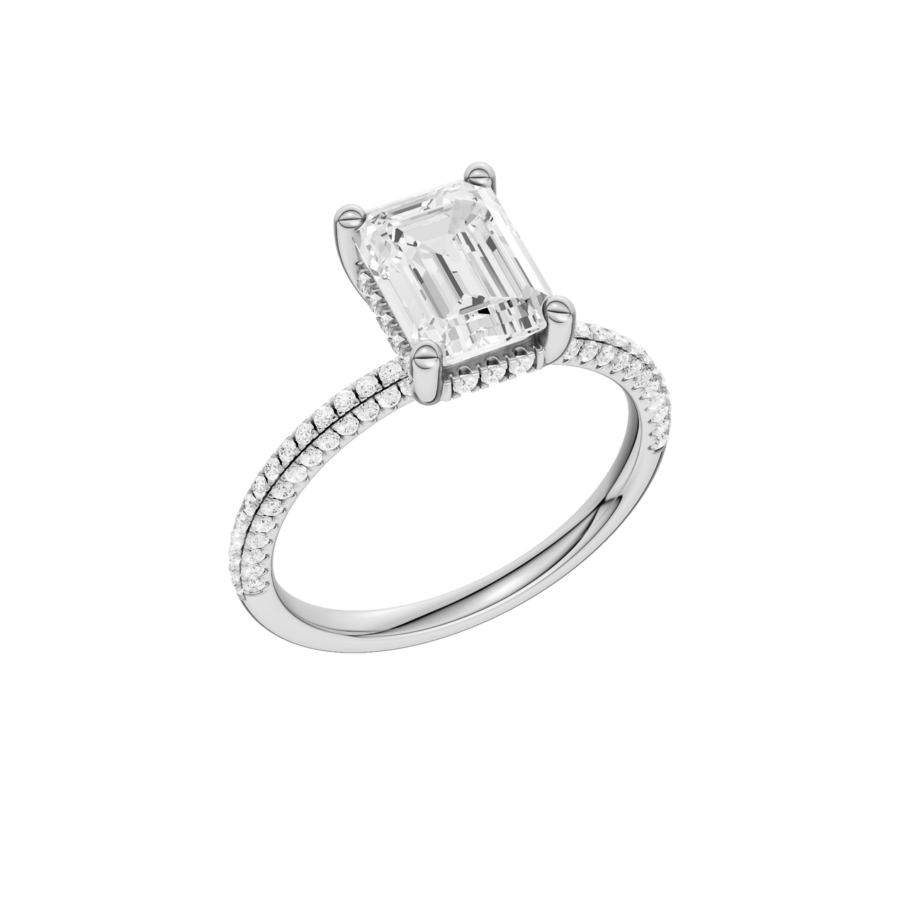 A three-quarter view of the Emerald cut diamond engagement ring in platinum with a pavé diamond band and cathedral setting