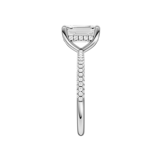 A side view of the Emerald cut diamond engagement ring in platinum with a pavé diamond band and cathedral setting
