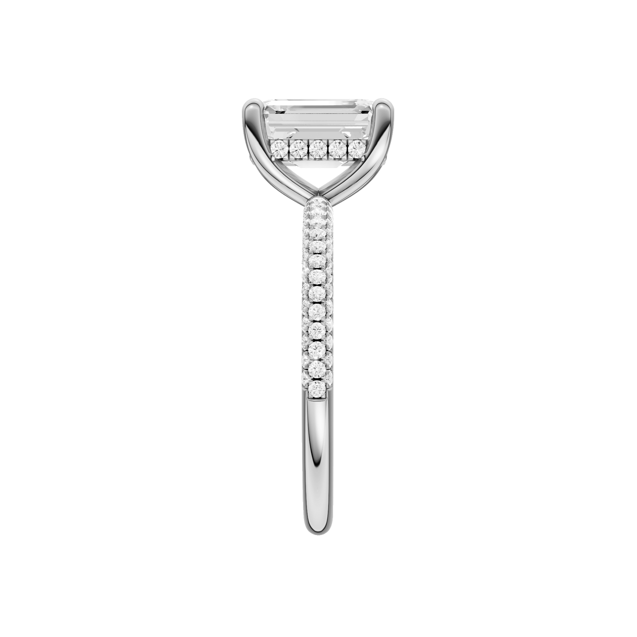 A side view of the Emerald cut diamond engagement ring in platinum with a pavé diamond band and cathedral setting